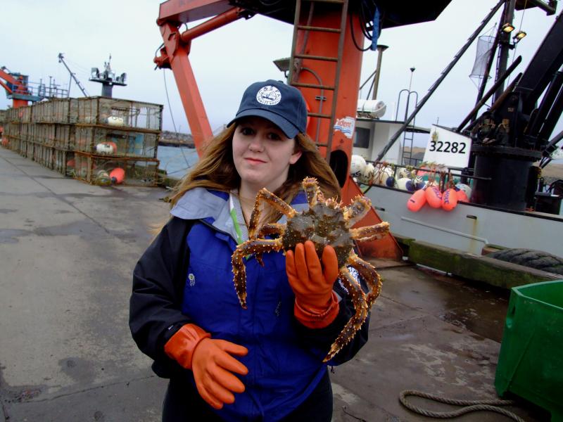 Celeste Leroux holding a crab.