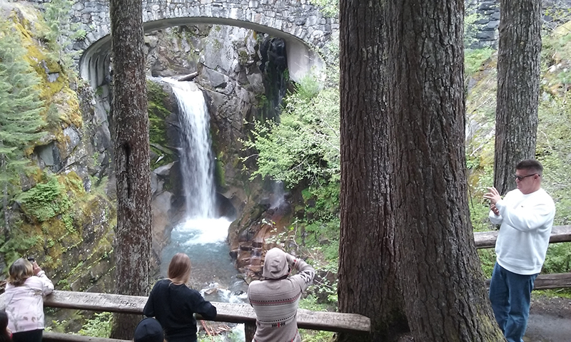 Guests take photos during one of Cheryl's NW tours.