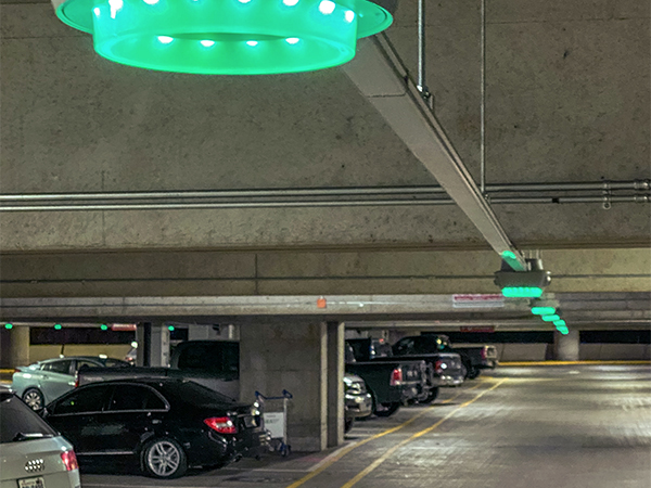 Green lights installed above parking stalls indicating open spots at SEA Airport garage.