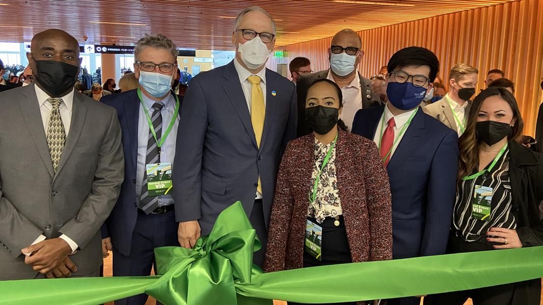 State and local leaders including Governor Inslee cut a green ribbon to celebrate the reveal of the Internation Arrivals Facility.