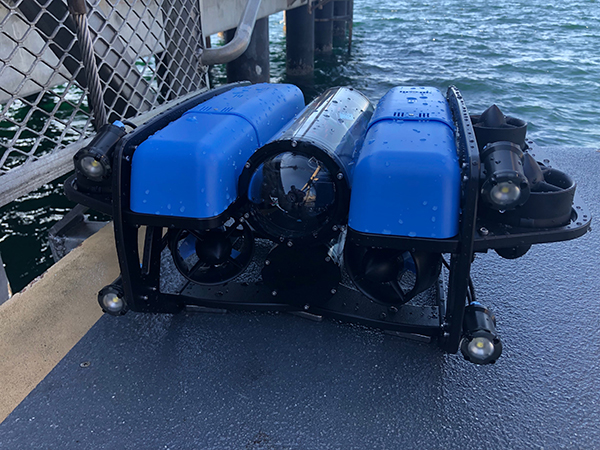 The Blue2 Remotely Operated Vehicle (ROV) sits ready for deployment on a pier at Elliott Bay.