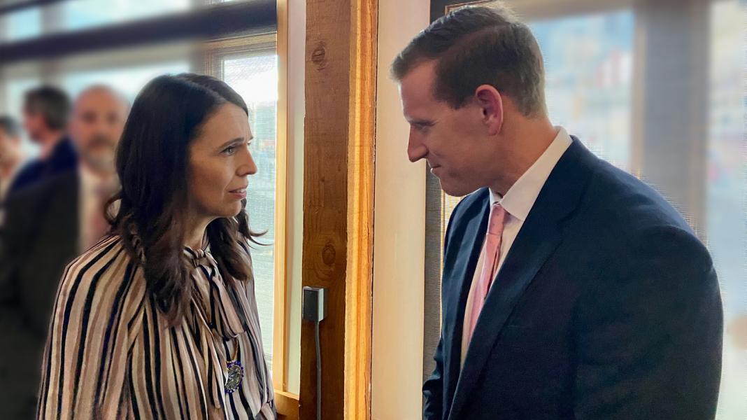 NZ Prime Minister Ardern talks with Port Commissioner Calkins.