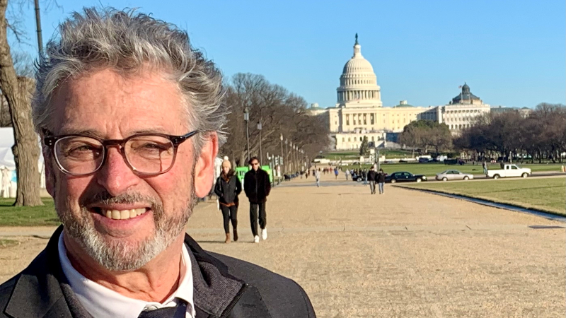 Felleman in front of the Capitol building in Washington, DC.