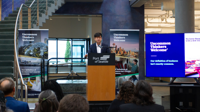 Sam Cho giving a presentation at the Port of Seattle office.