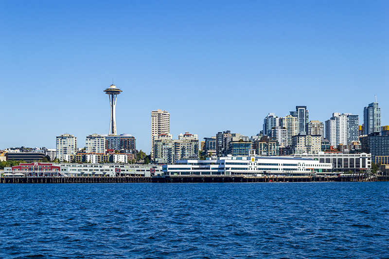 Seattle waterfront with the Space Needle and downtown buildings viewed from across the water.