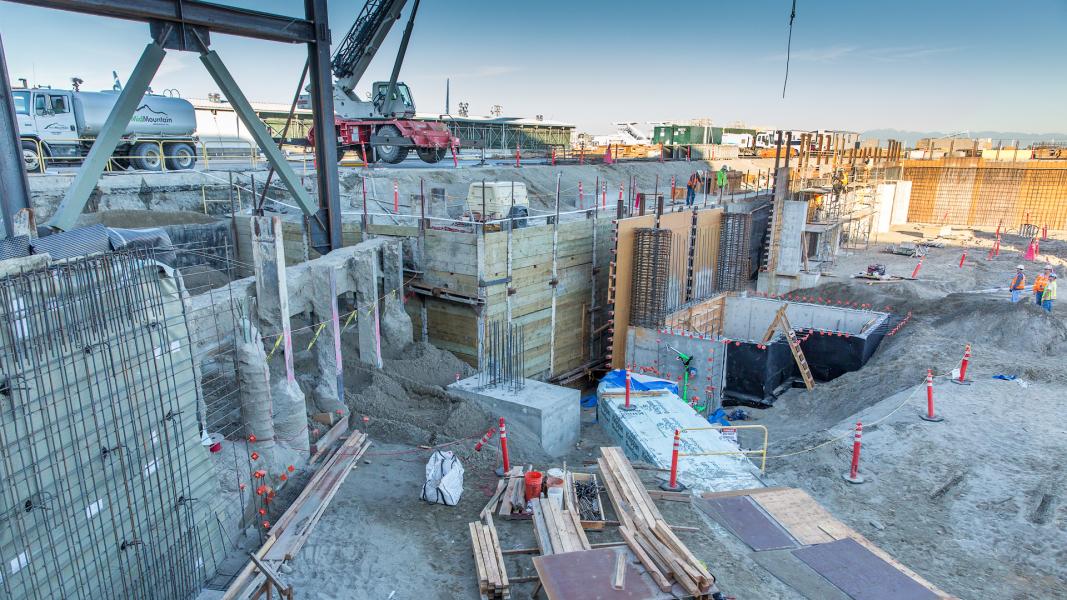 North Satellite construction site - pit with structural columns going in.