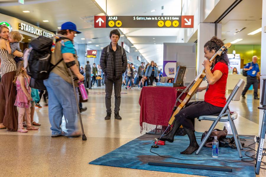 Musician playing in the terminal at Sea-Tac.