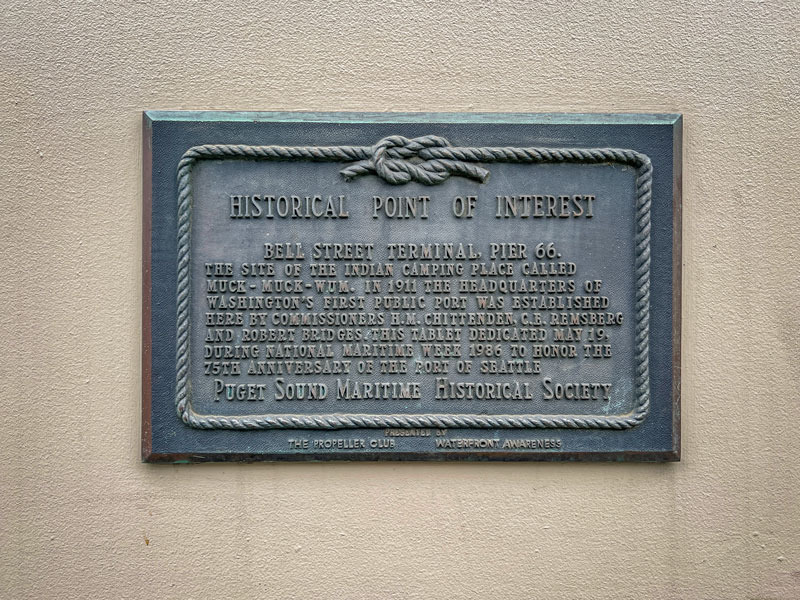 A mounted plaque labeled “Historical Point of Interest” describes the history of Bell Street Terminal at Pier 66.