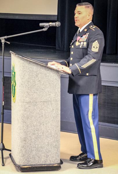 Chad Aldridge speaking at a podium.