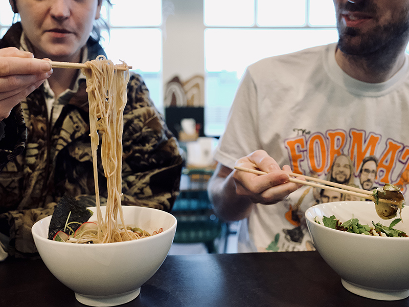 Customers eating ramen.