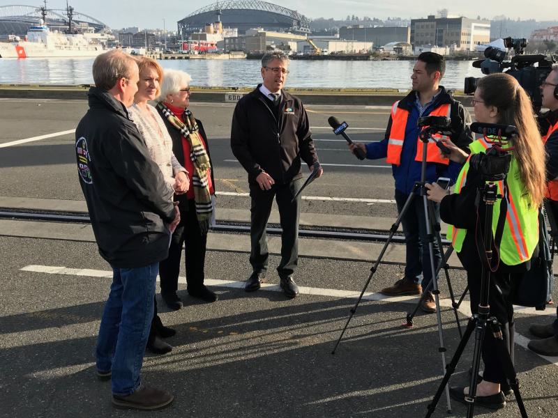 Comissioner Felleman and others with the media.