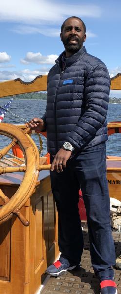 Earl Parker steering a ship.