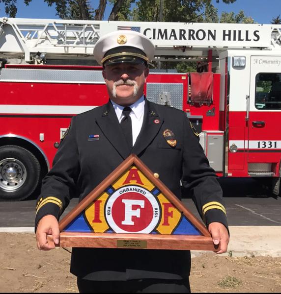 Todd Starkey with an award.