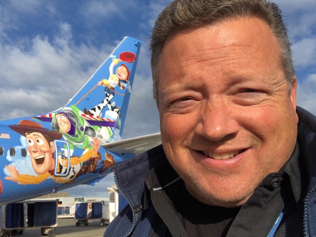 Steve Downey in front of a plane.