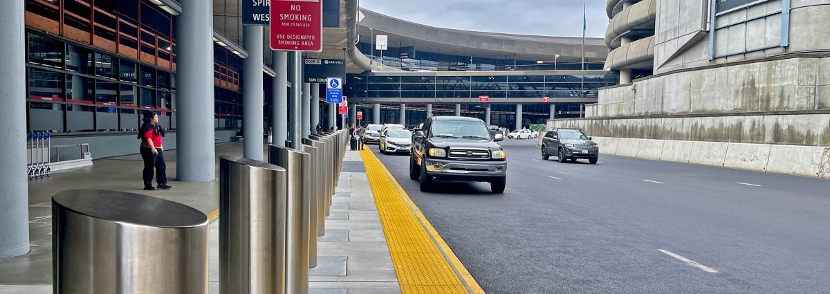 Arrivals Drive Roadway with Zero Grade Curb.