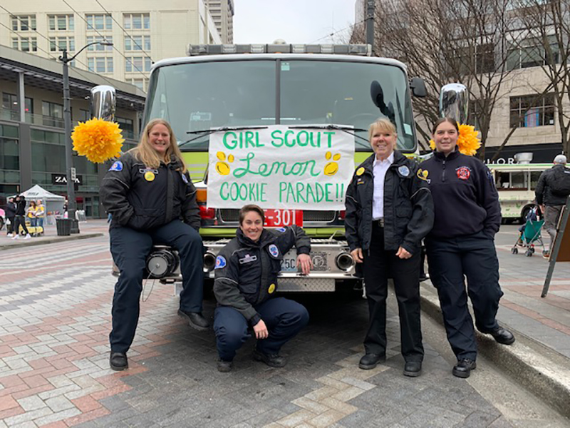 Port of Seattle female firefighters in front of a fire truck.
