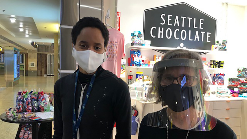 SEA Airport tenants in AntoGen masks.