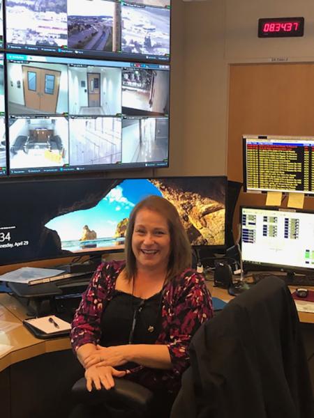 Susan Lee in front of multiple monitors.
