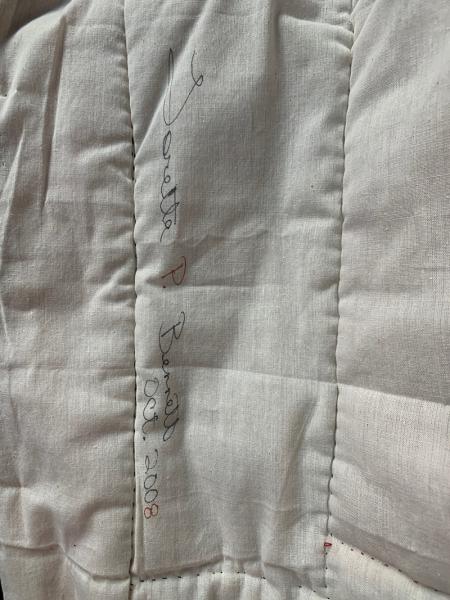 Loretta Bennett signature on a quilt.