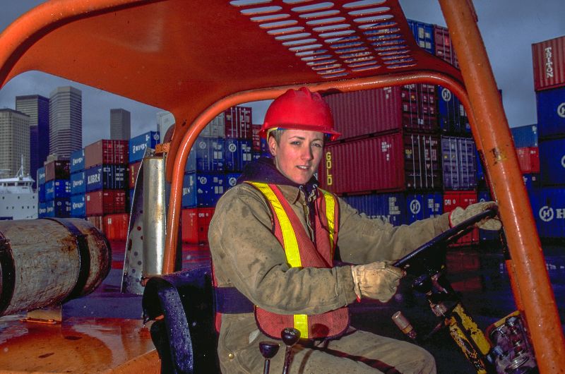 Kevin Catherine Castle wearing a hard hat and safety vest, operating equipment.