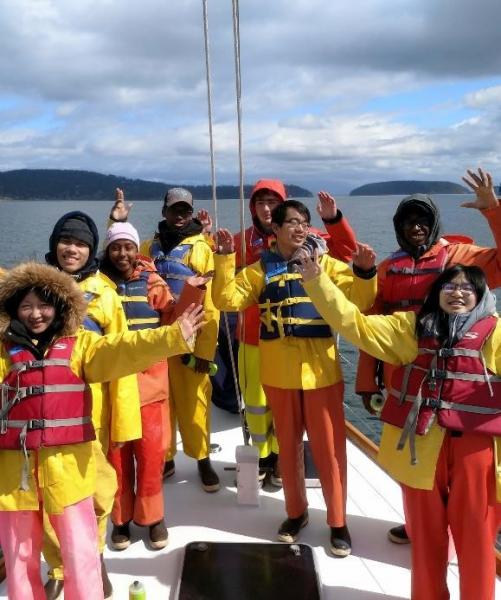 Students learn about maritime education on a boat.
