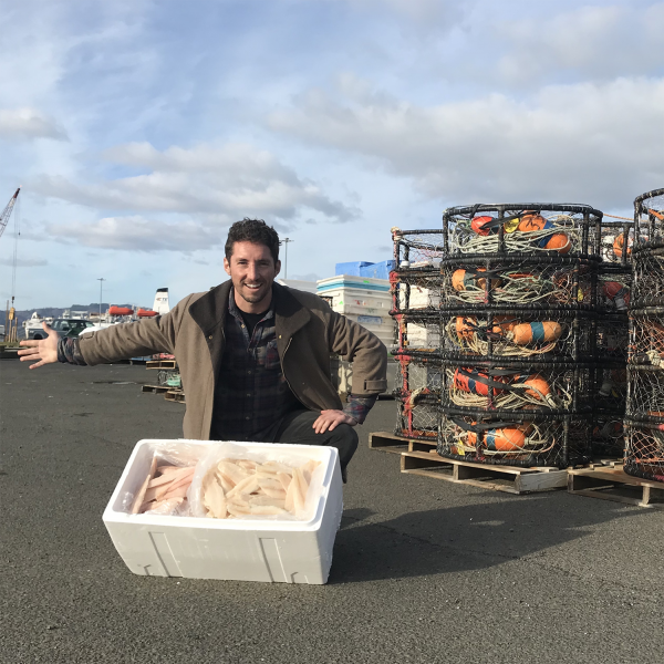 Nick Mendoza with fish in a cooler.