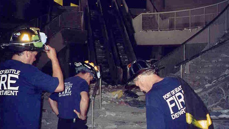 9-11 Recovery squad in a lobby that is destroyed.