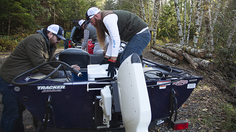 Installing a motor on a small boat.