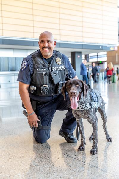 Police officer and a canine officer.
