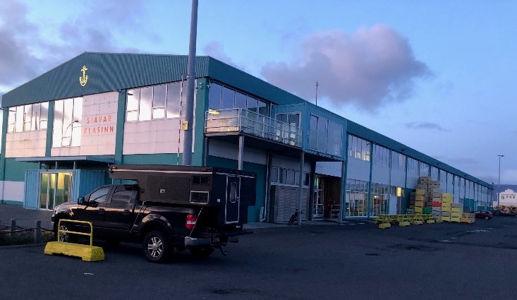 Port of Reykjavik Ice House Coworking Space building exterior at dusk.