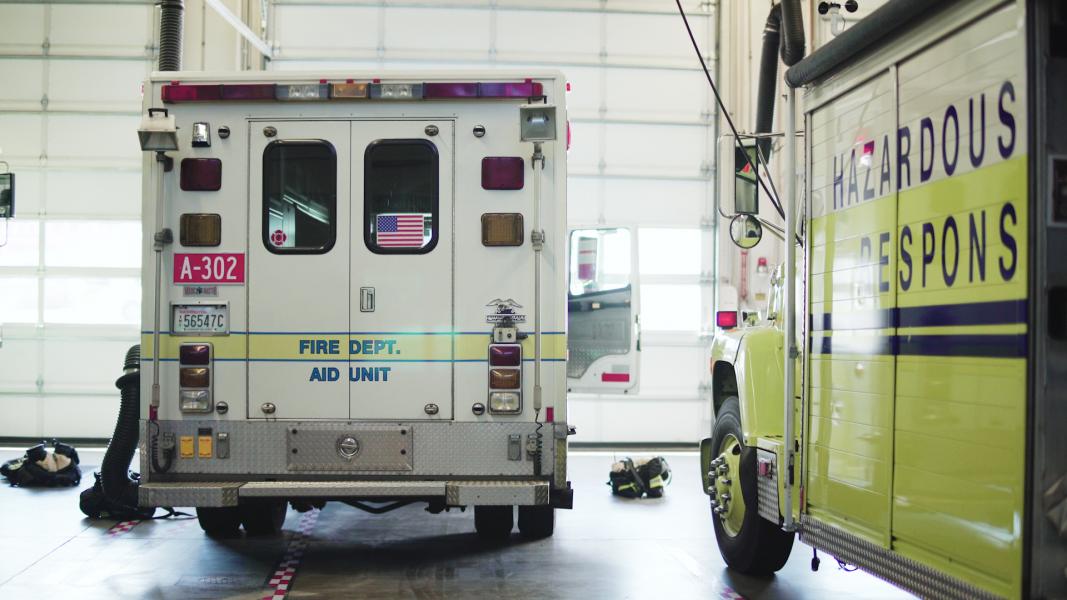 Fire department vehicles parked inside the fire station.