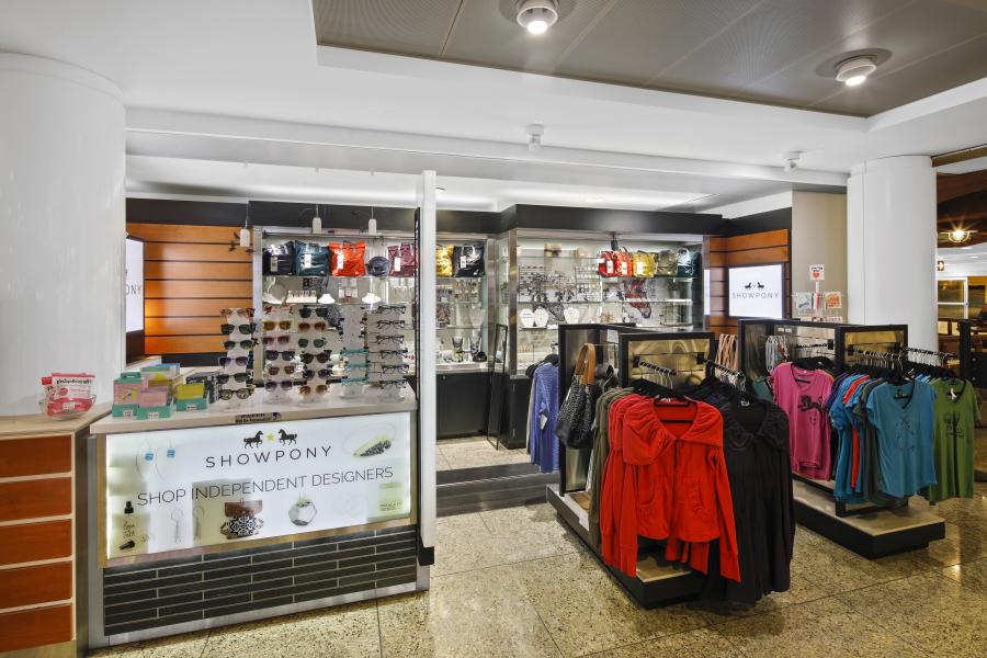 The exterior of the Show Pony boutique showing apparel and accessories for travelers. 