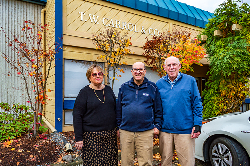 Gayle, Andy, and Joe Carrol outside of TW Carrol