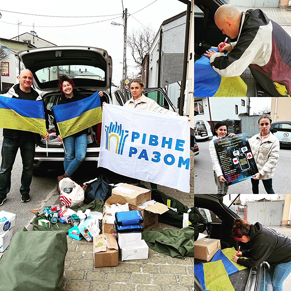 Collage showing people outdoors with an open vehicle trunk, supplies and boxes on the ground, and blue‑and‑yellow flags with printed text and a Cyrillic logo. Additional images show individuals signing a flag and holding a poster.