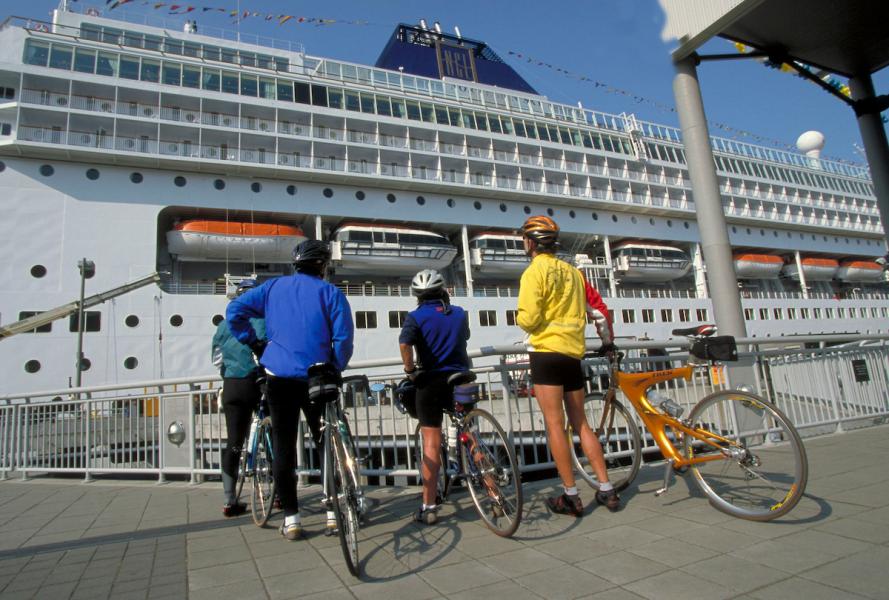 Bikers watch cruise ships dock in Seattle.
