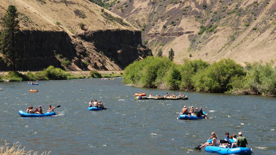 River rafters float down the Wenatchee River in Chelan County.