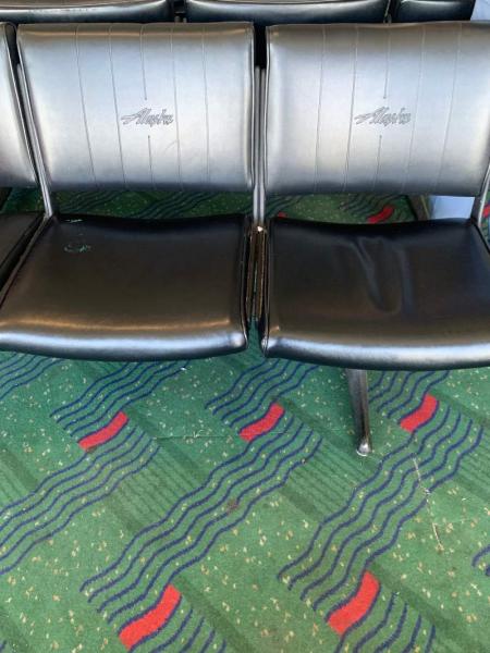 The old, green, patterned carpet at the North Satellite.