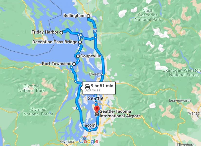 Map showing a driving route from Seattle–Tacoma International Airport through Seattle, Tacoma, Port Townsend, Coupeville, Deception Pass Bridge, Friday Harbor, and Bellingham, with a total distance of 328 miles and an estimated time of 9 hours 51 minutes.