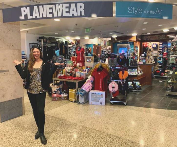 Jennifer Longley in front of the Planewear storefront.