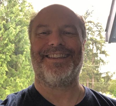 Dave Kaplan smiles at the camera.