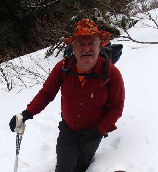 Erik Knowles hiking through the snow.