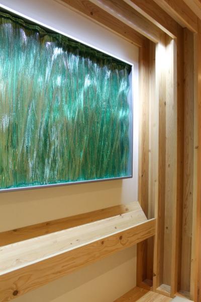 Green glass decorative panel in the SEA prayer room.