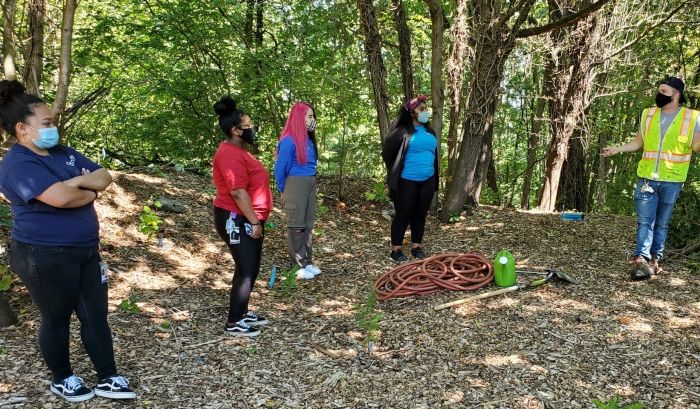 Youth working at a park.