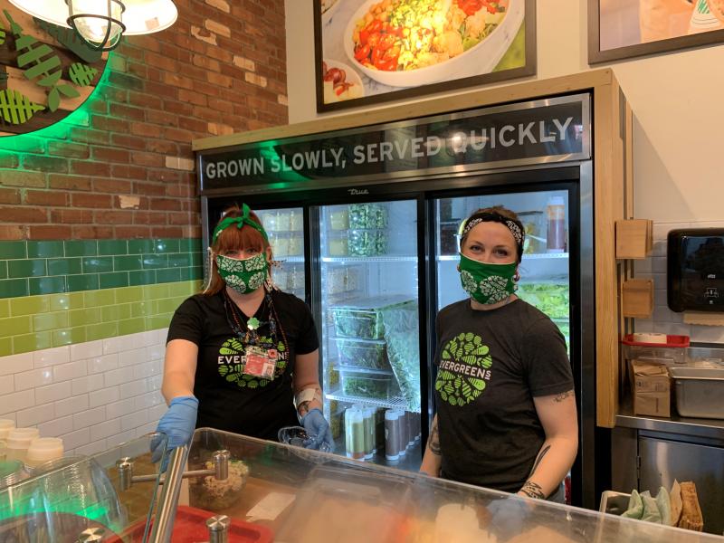 Evergreens employees wear face masks and gloves.