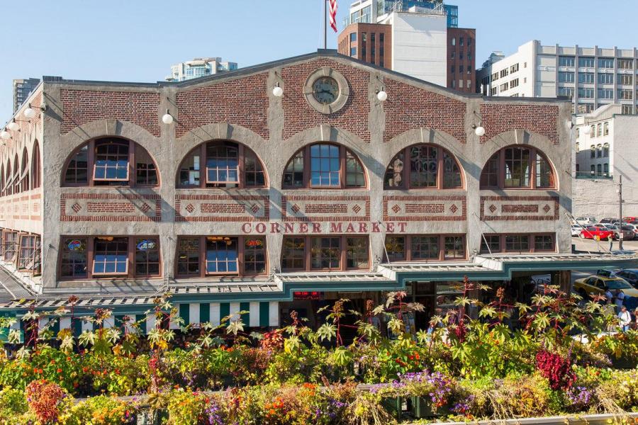 Pike Place market building with flowers.