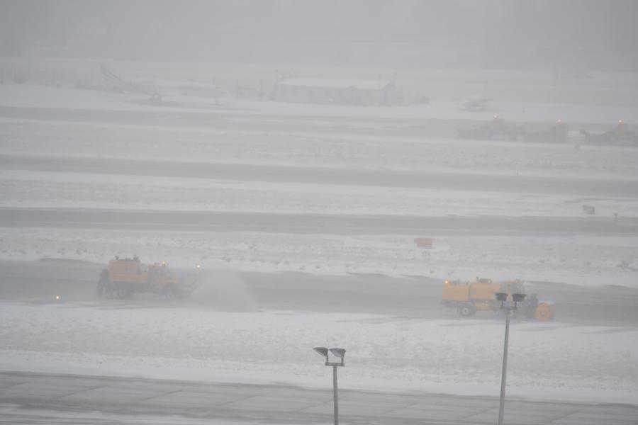 Snow plows on the runway.