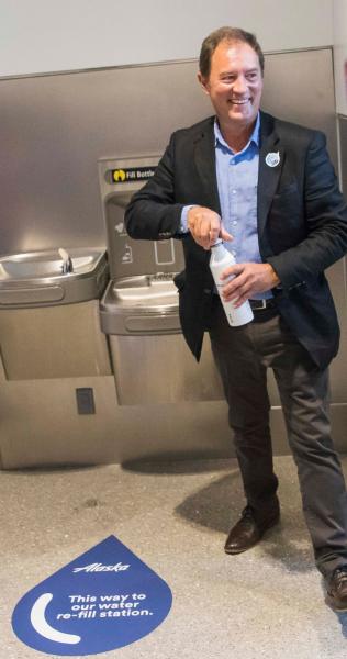 Commissioner Steinbrueck uses a refill station.
