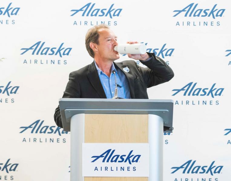 Commissioner Steinbrueck drinks out of a refillable bottle at SEA.