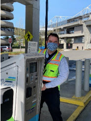 John van Deinse by a parking payment machine.