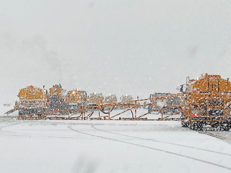 Snowplows at SEA in a flying V formation.